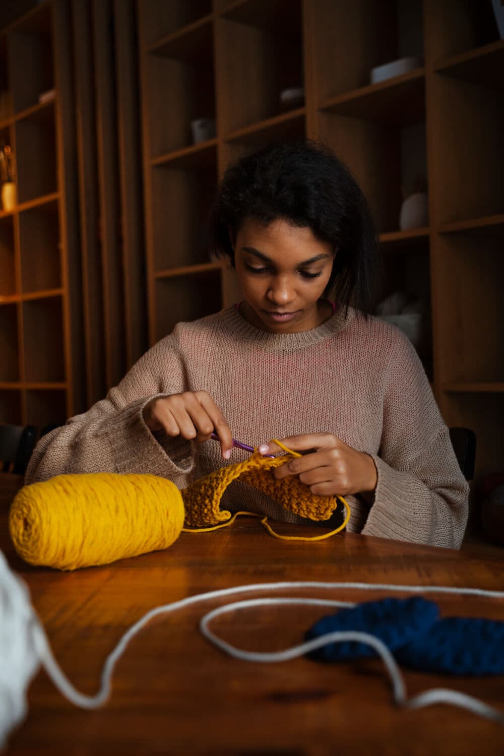 Tailor working by hand in her studio